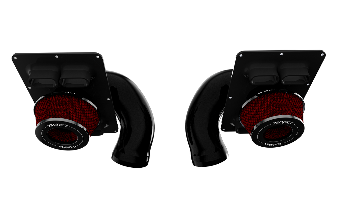 Both left and right Project Gamma intake assemblies for the McLaren 570S, each with a red filter element fitted beneath an airbox top plate carrying two rectangular supplemental openings.