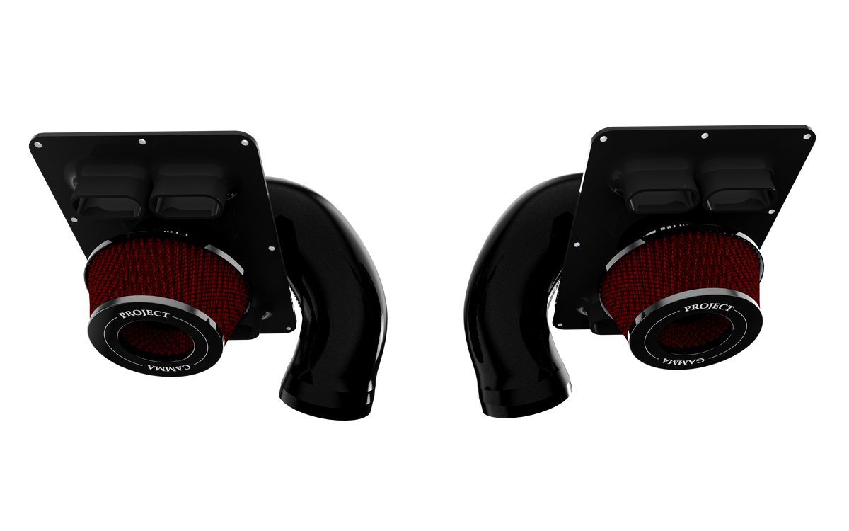 Both left and right Project Gamma intake assemblies for the McLaren 570S, each with a red filter element fitted beneath an airbox top plate carrying two rectangular supplemental openings.