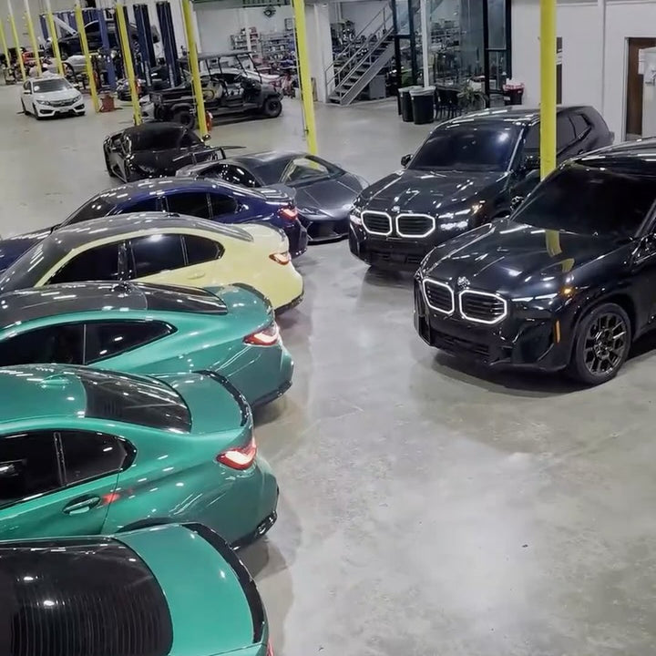 Instagram reel: European and exotic cars lined up inside the Project Gamma facility in Houston