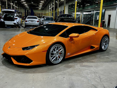 Orange Lamborghini Huracán inside the Project Gamma workshop in Houston