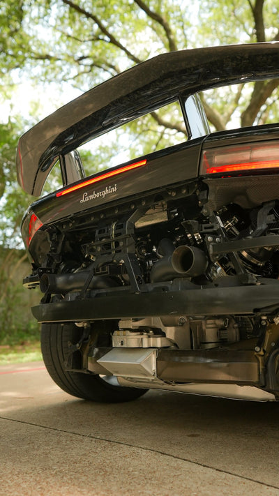 Underside rear view of a Lamborghini Huracán Performante showing the twin turbochargers and exhaust