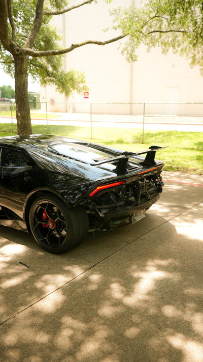 Black Lamborghini Huracán Performante with a Project Gamma twin turbo kit, rear three-quarter view